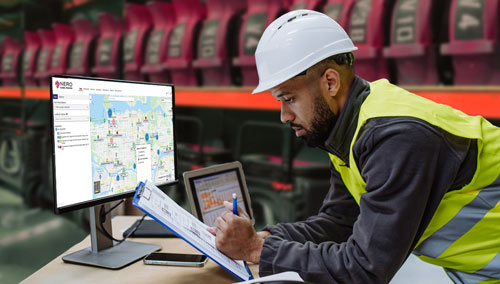 Technician in warehouse managing equipment inventory